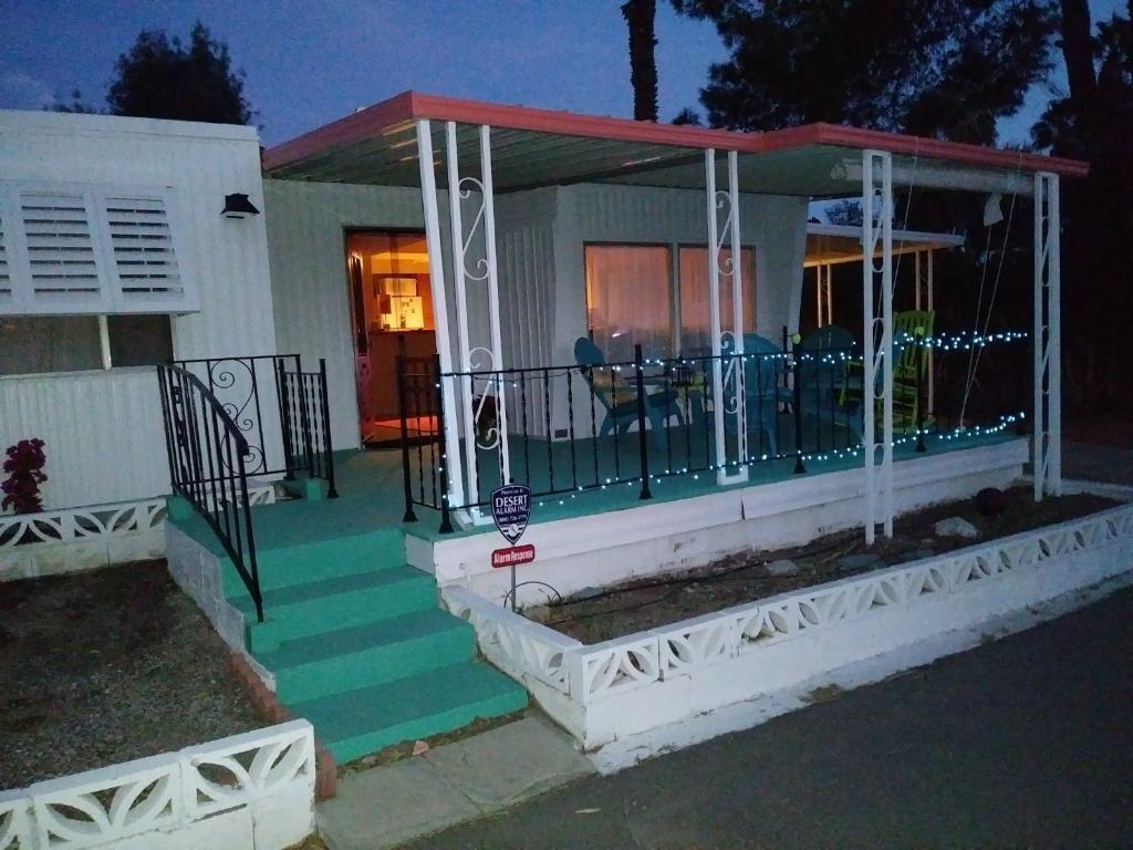 a view of a house with backyard sitting area and garden