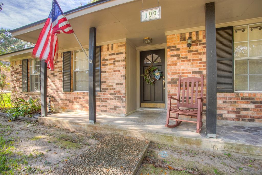 a view of front door with outdoor seating