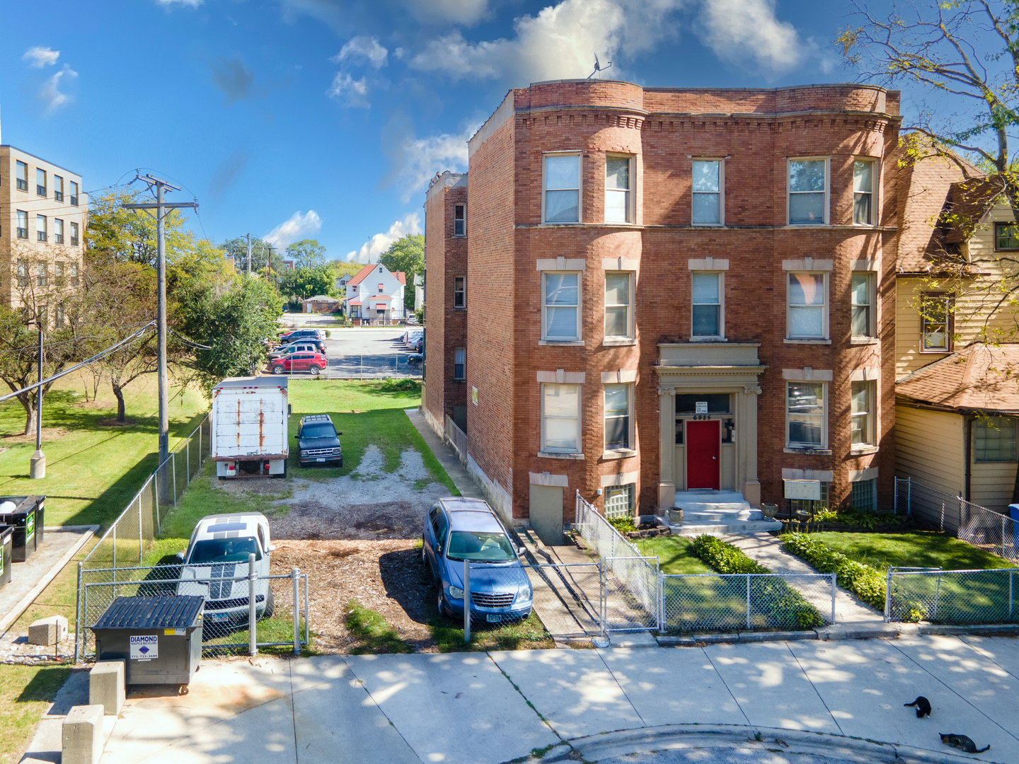 a view of a building with a yard