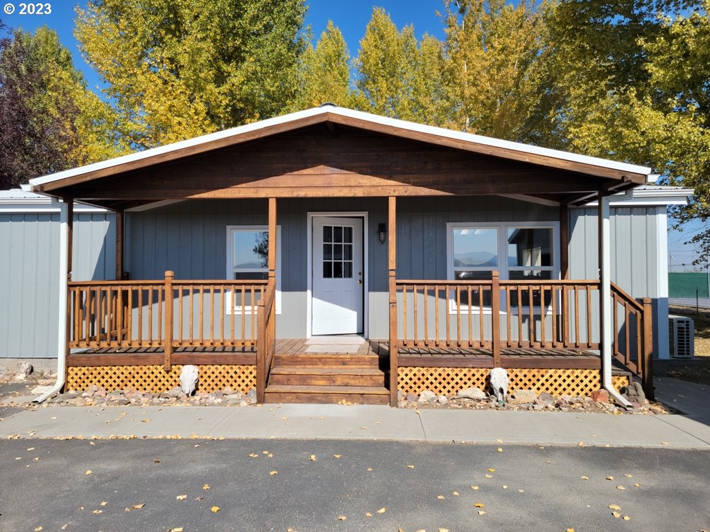 a view of a house with wooden fence