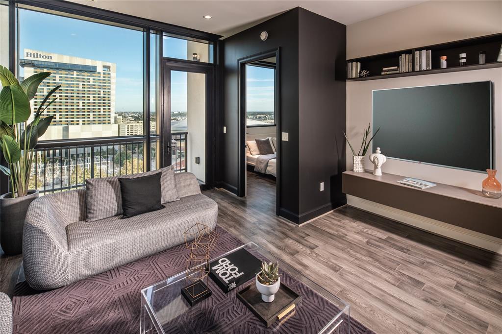 a living room with furniture and a flat screen tv