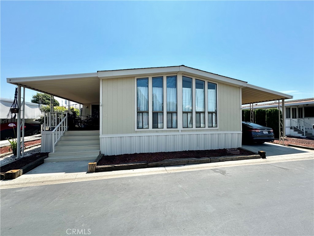 a view of a car park in front of a house