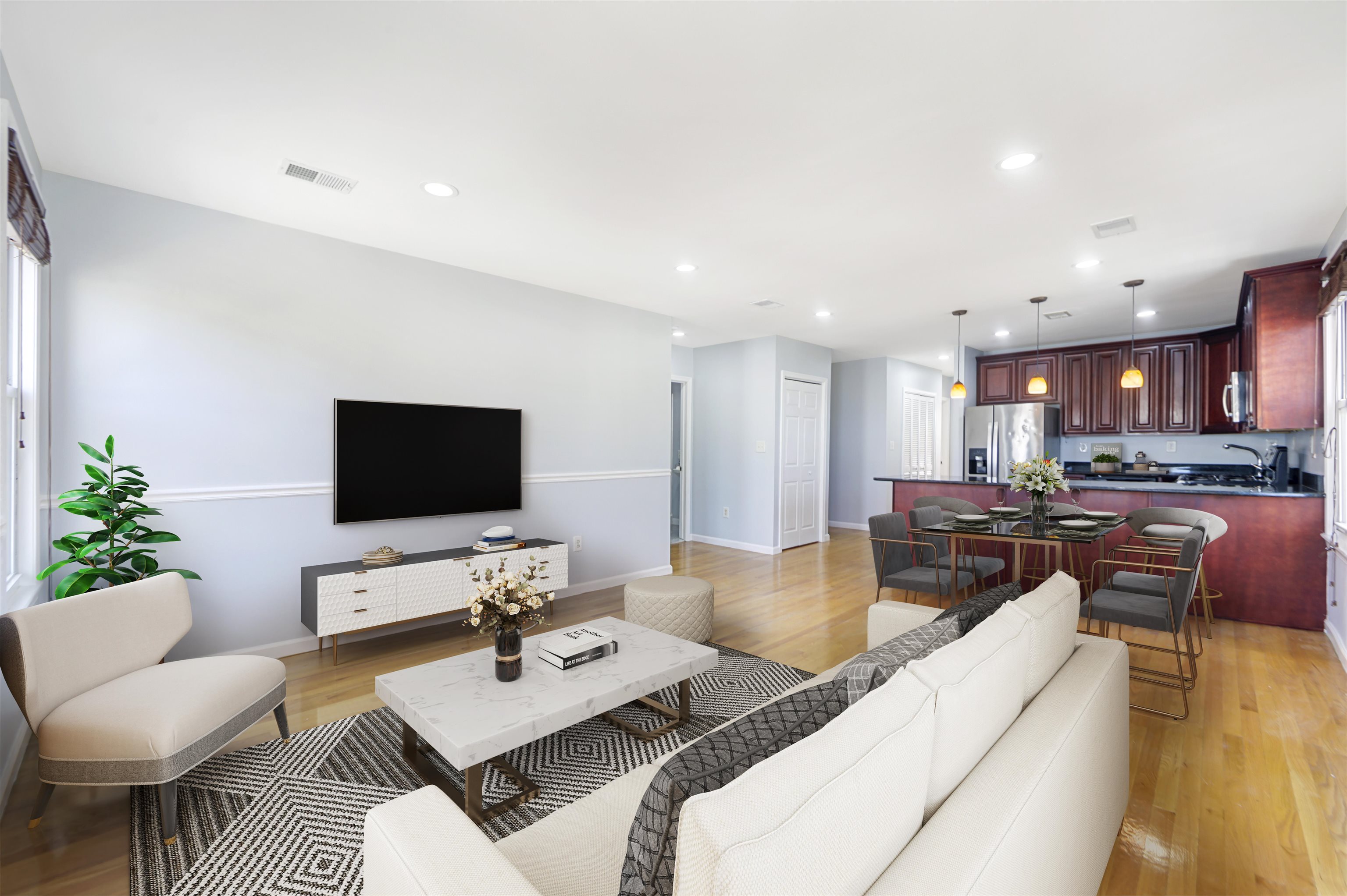 a living room with furniture and a flat screen tv