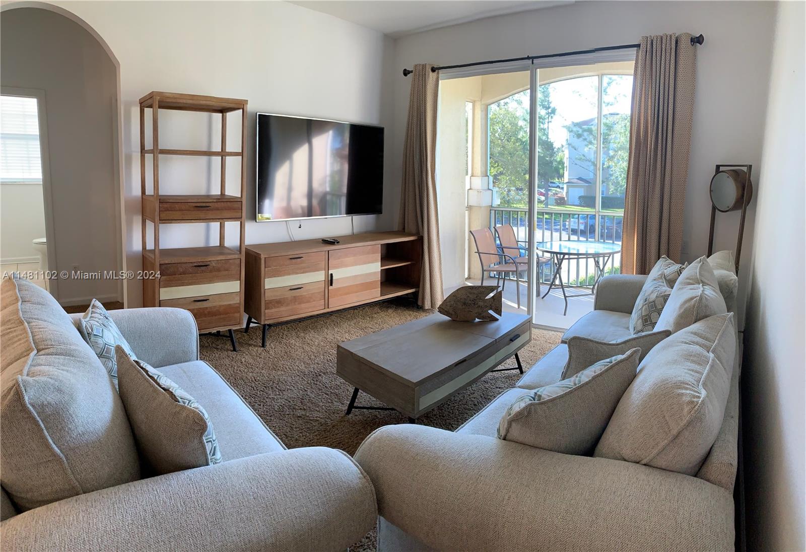 a living room with furniture and a window