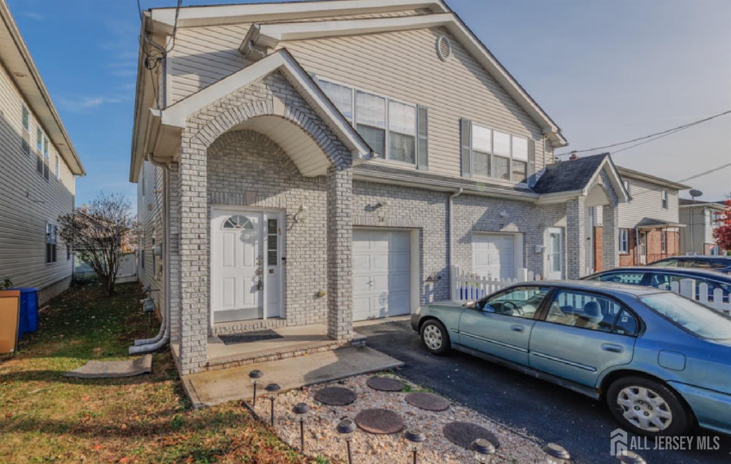 a view of a car park in front of a house