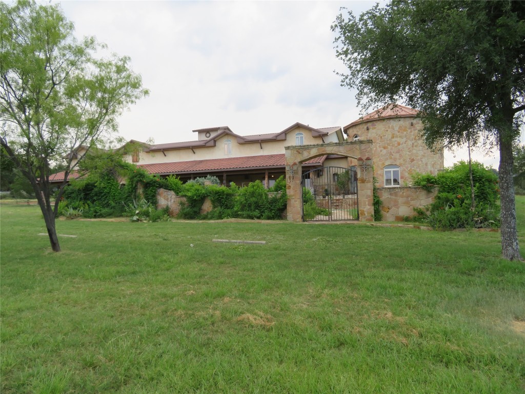 a front view of a house with garden