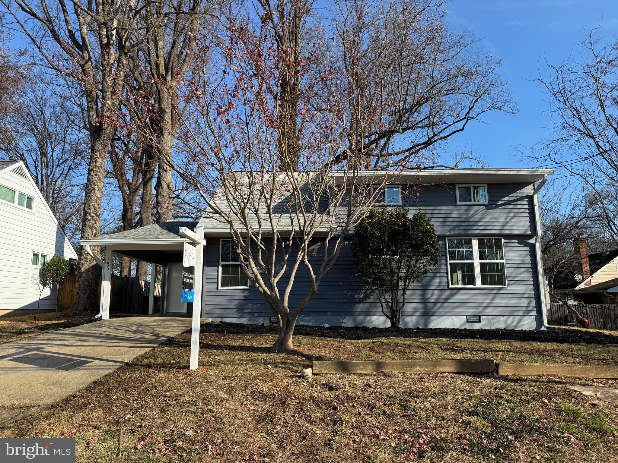 a view of a house with a tree