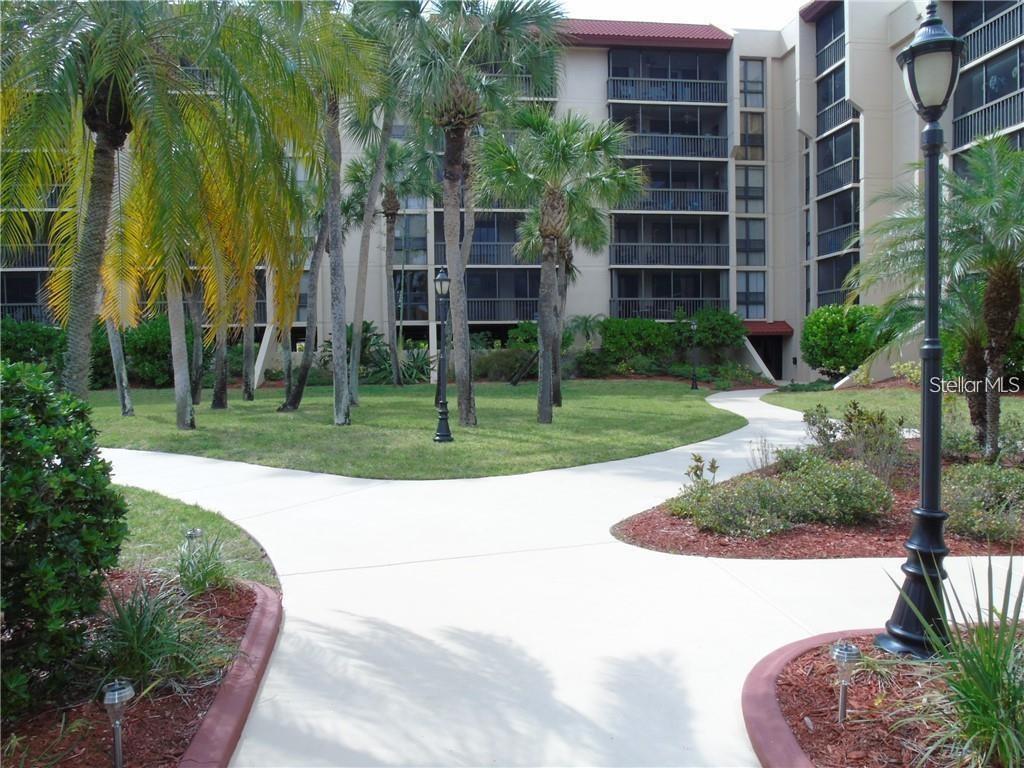 a view of a garden with a building