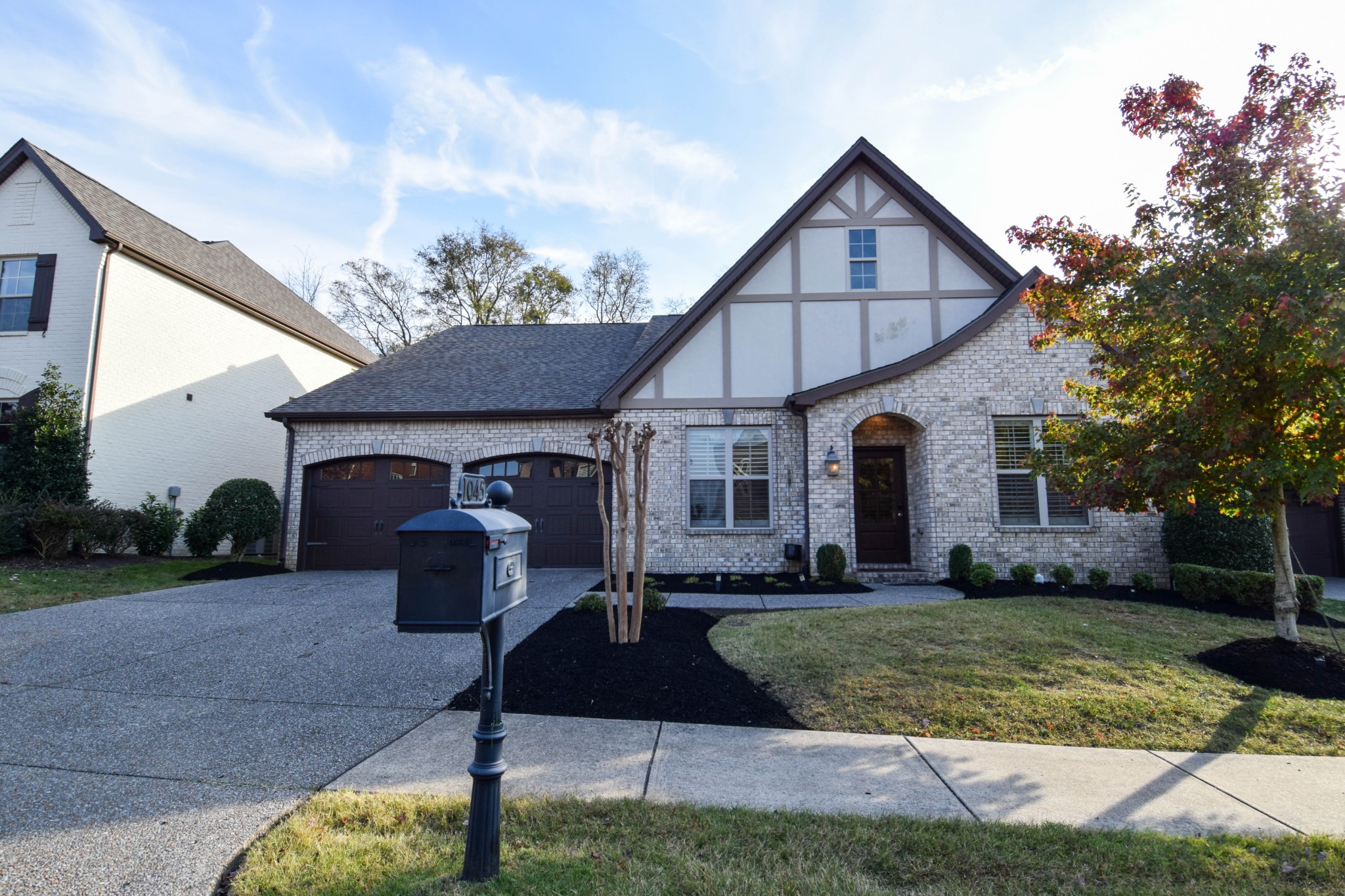 a front view of a house with garden