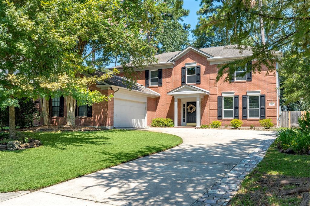 A long curved driveway graces the front of the stately home and leads to the attached 2 car garage.