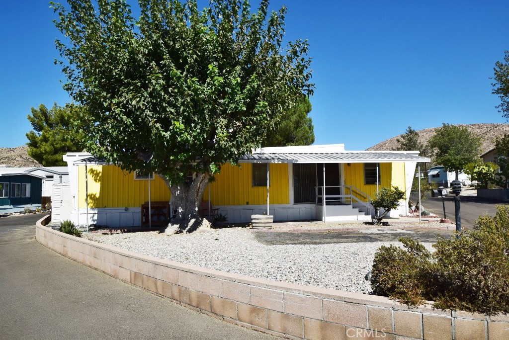 a front view of a house with a patio