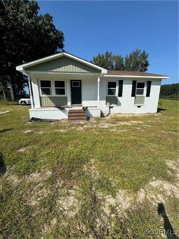 a front view of house with garden and porch