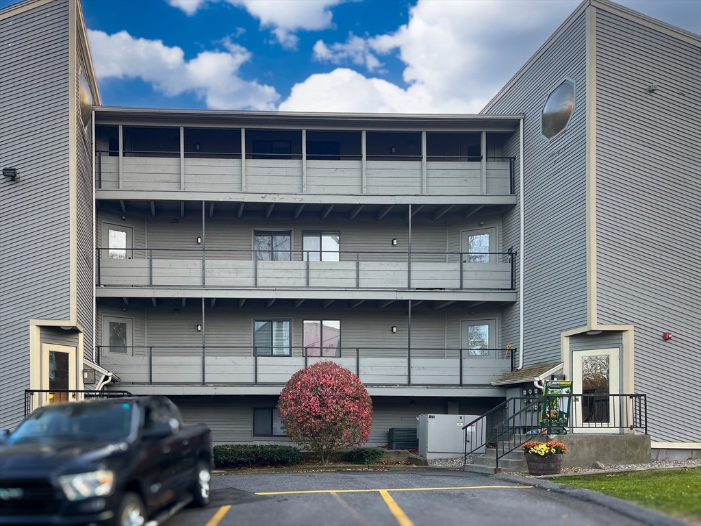 a front view of a house with parking