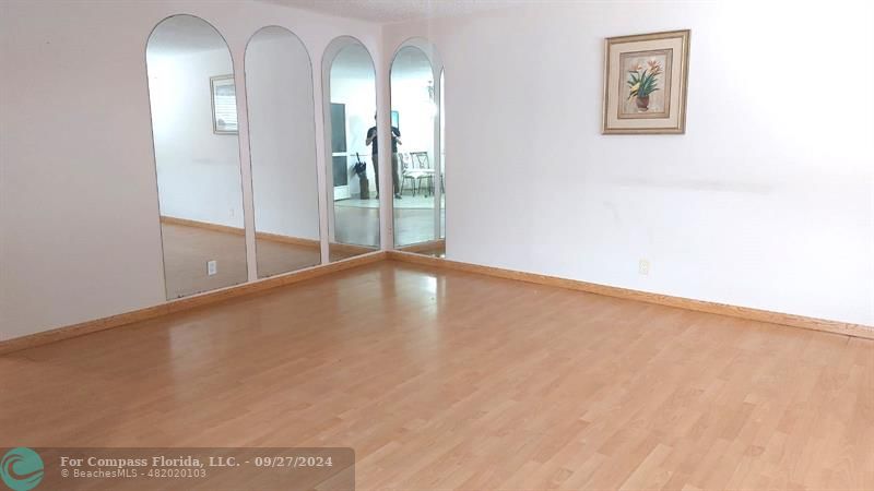 a view of an empty room with glass door