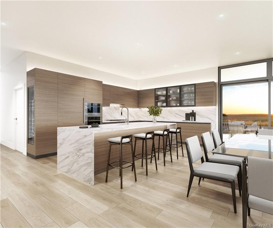 a dining room with furniture and a floor to ceiling window