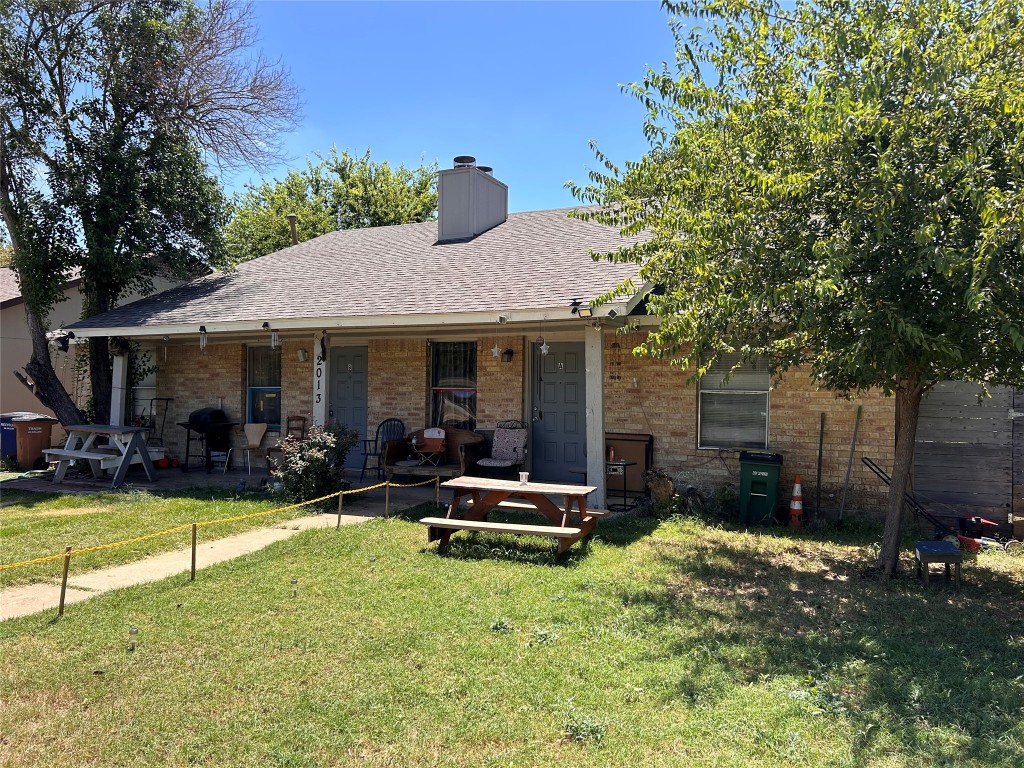 a view of a house with swimming pool and sitting area