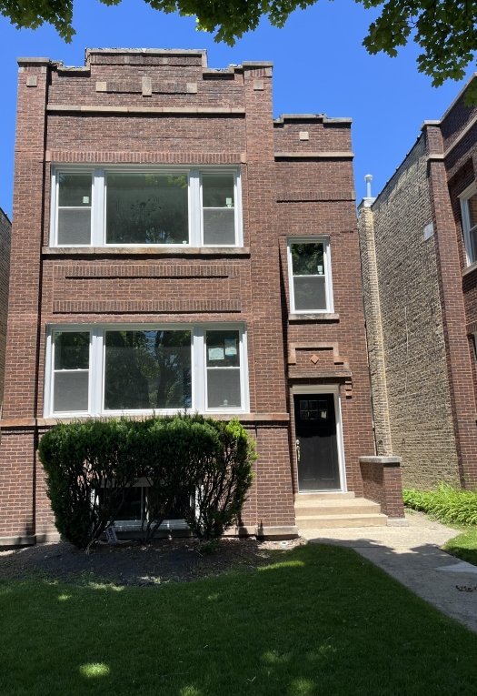 front view of a house with a yard