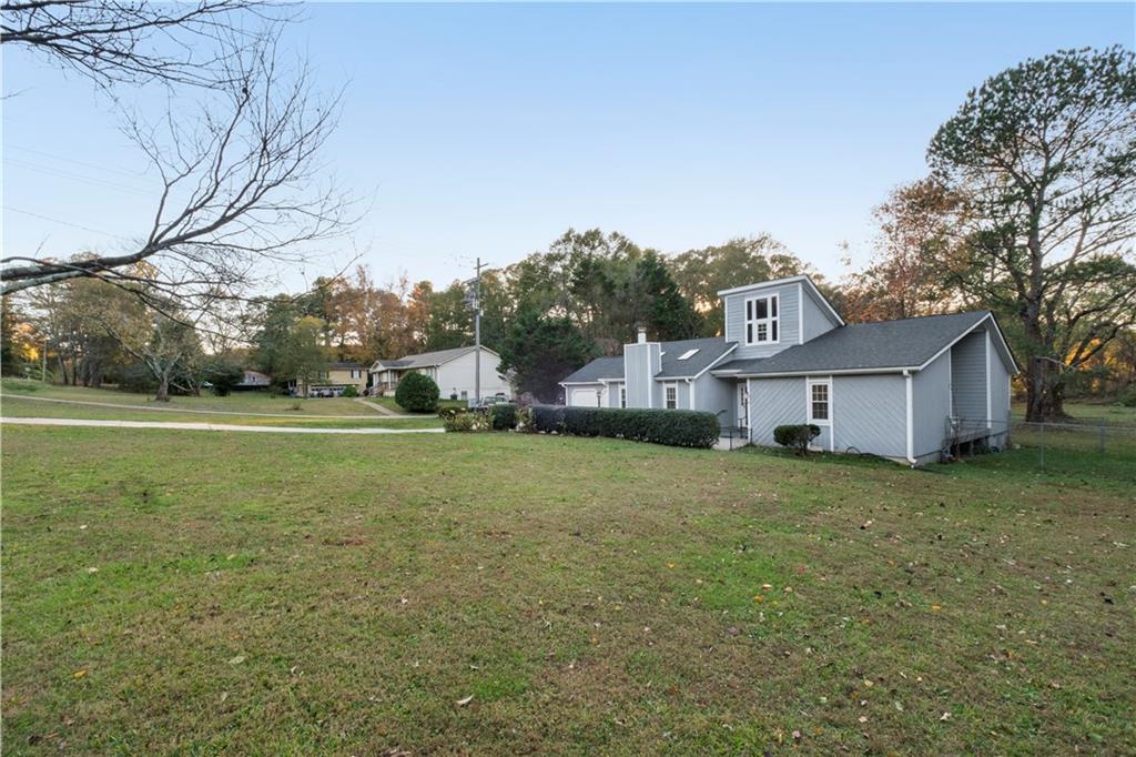 a view of a house with a big yard