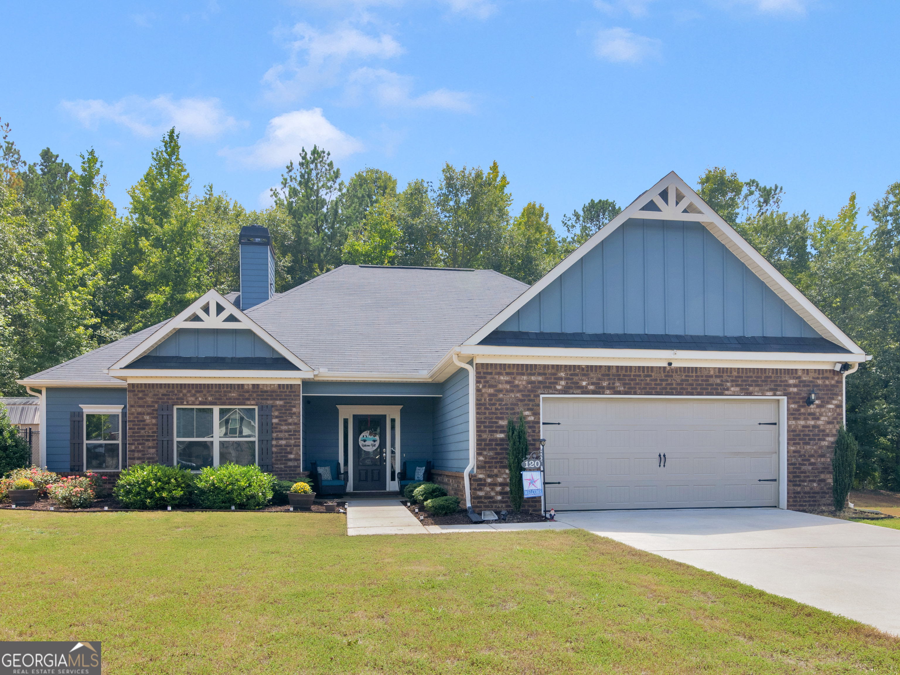 a front view of a house with a yard