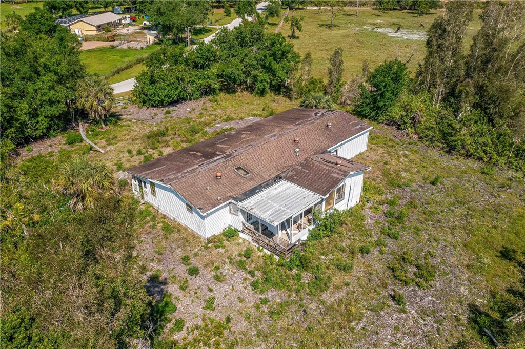 an aerial view of residential house with outdoor space