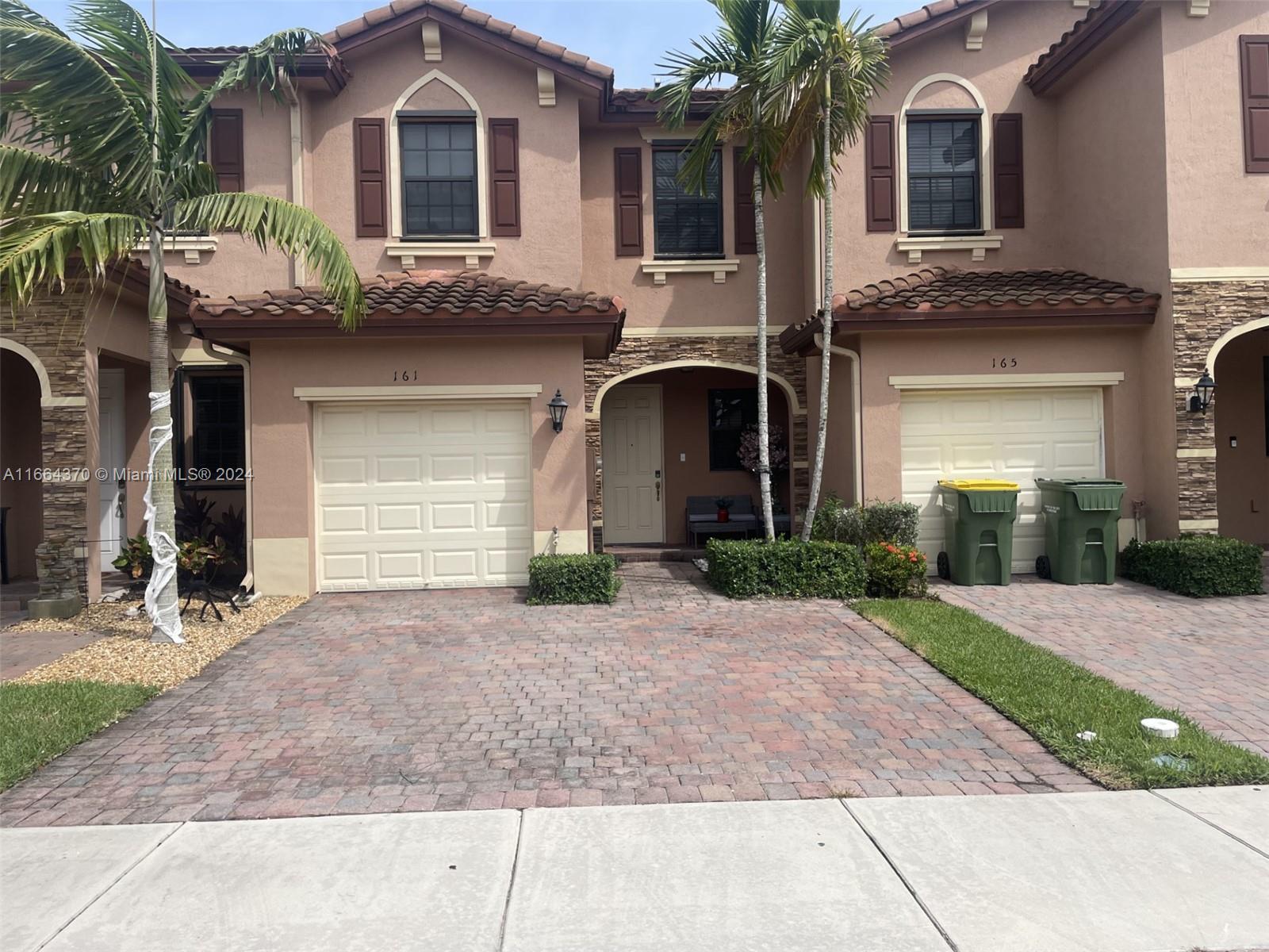 a front view of a house with yard