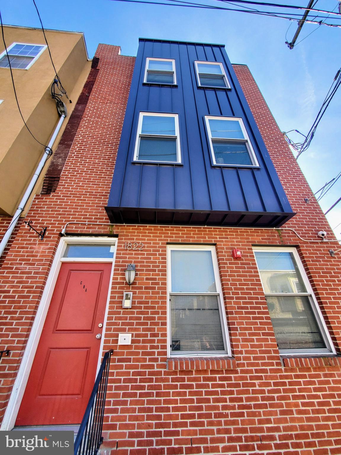 a building view with a brick wall