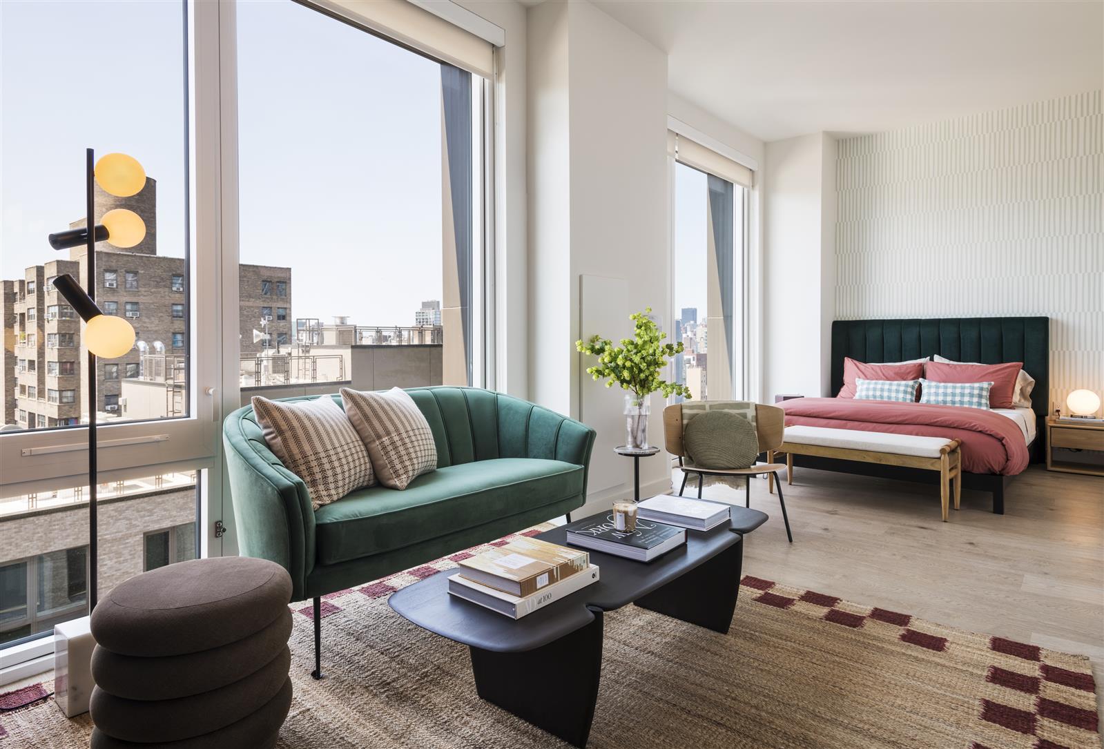 a living room with furniture and a floor to ceiling window