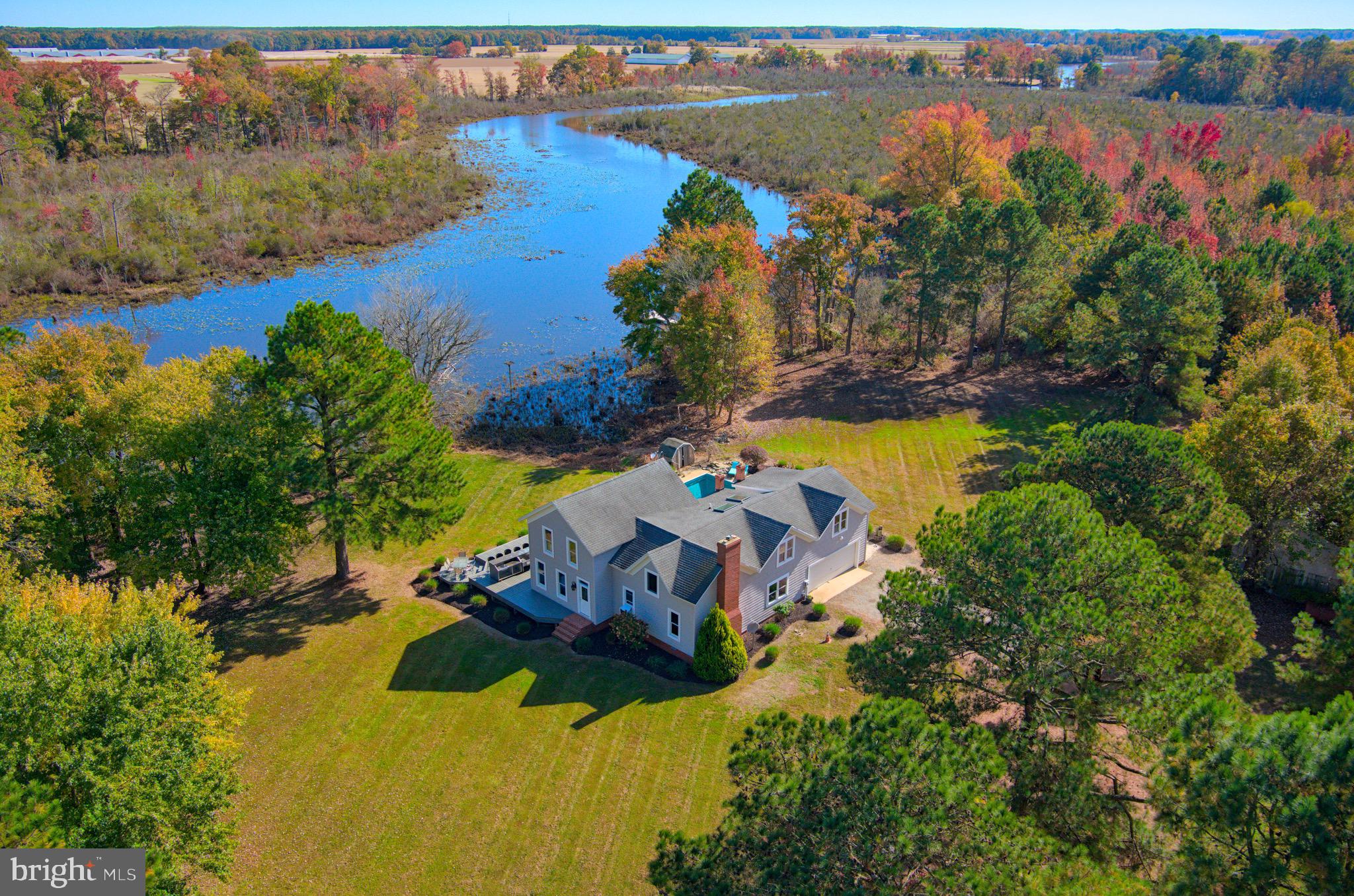 an aerial view of a house with a lake view