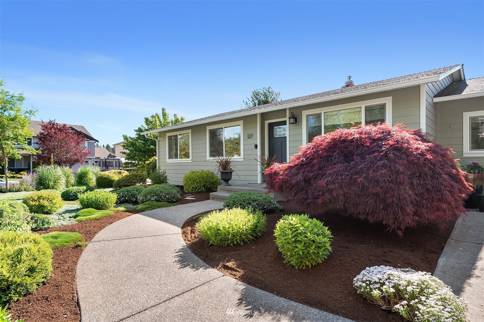 front view of a house with a yard