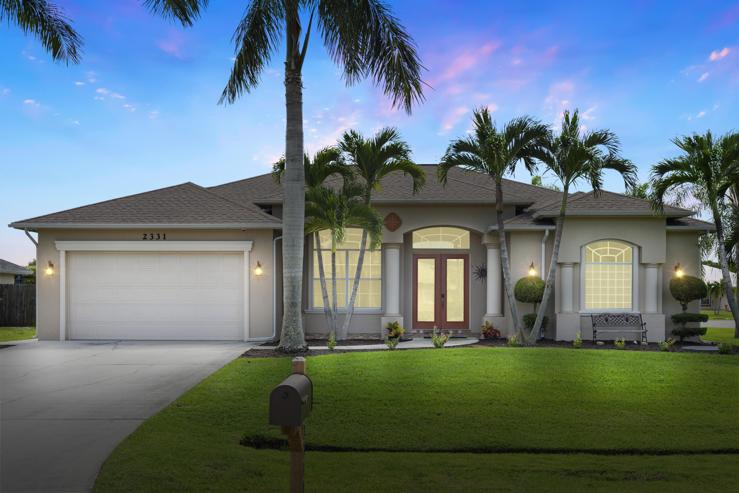 a front view of a house with garden