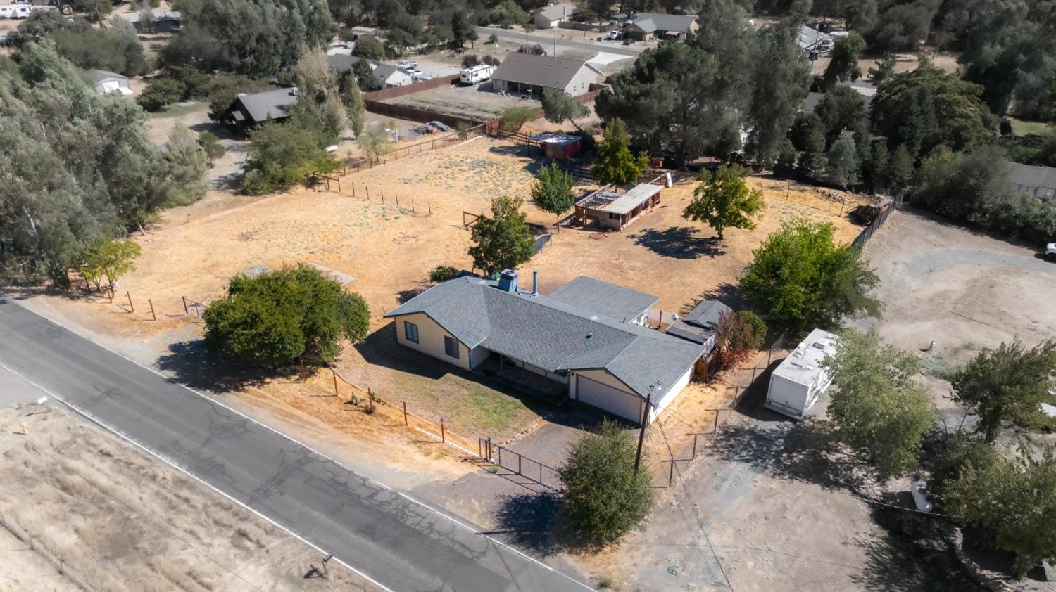 an aerial view of residential houses with outdoor space