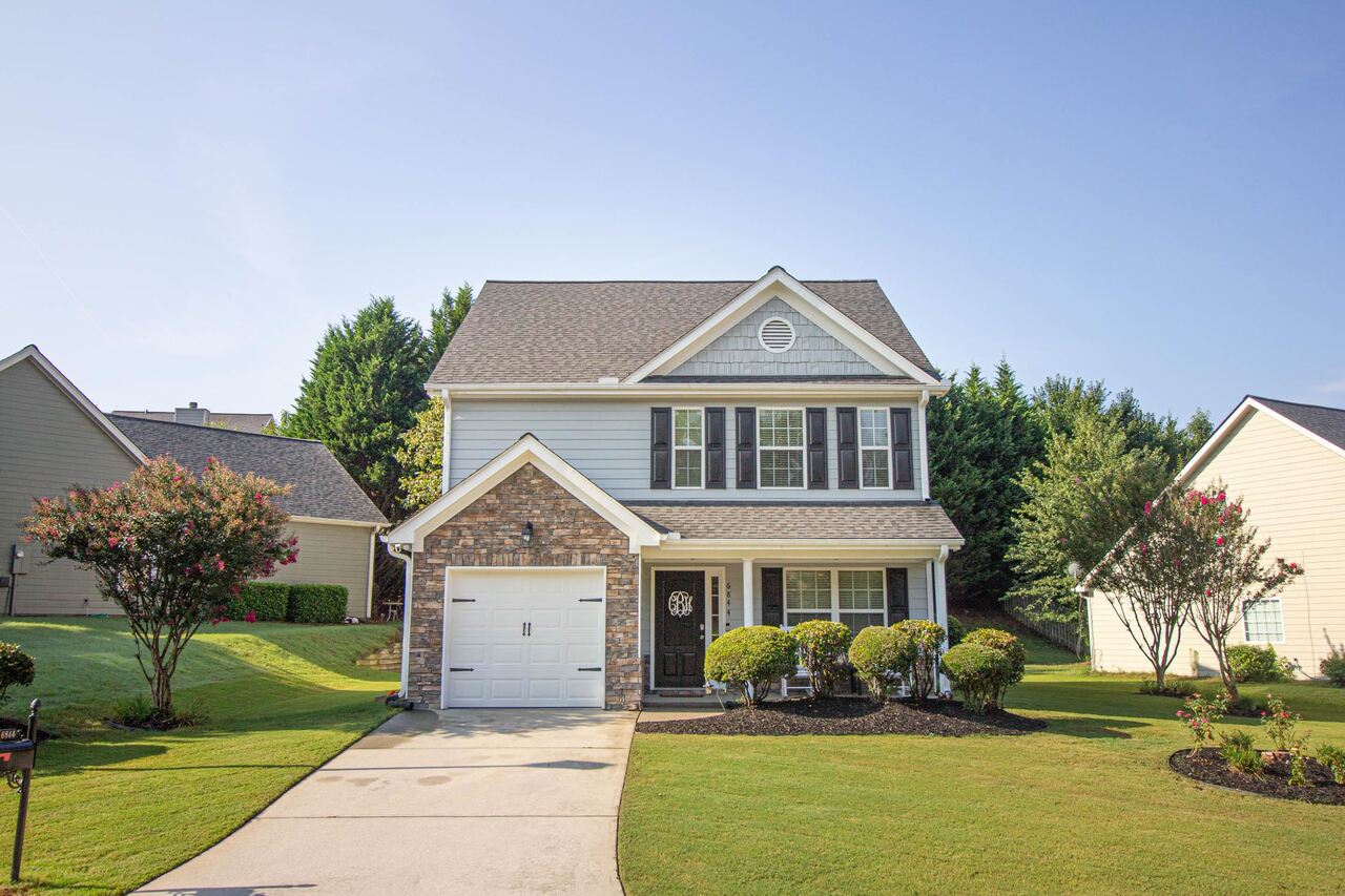 a front view of a house with a yard