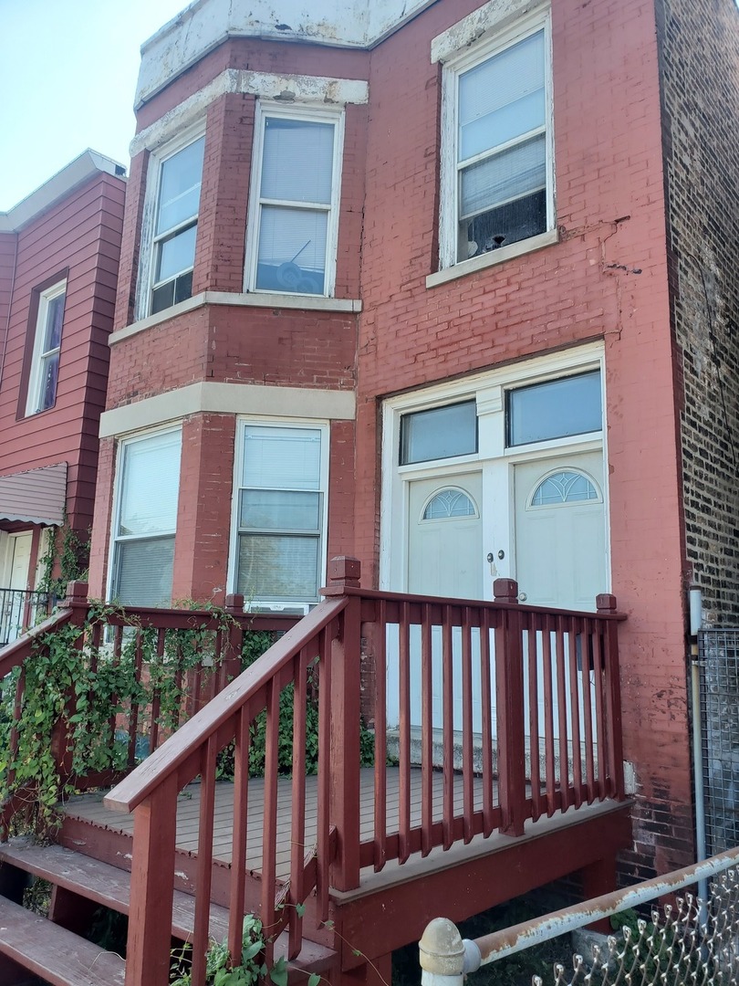 a view of a brick building with a large windows