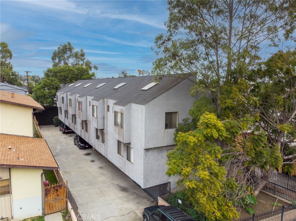 an aerial view of a house with a yard