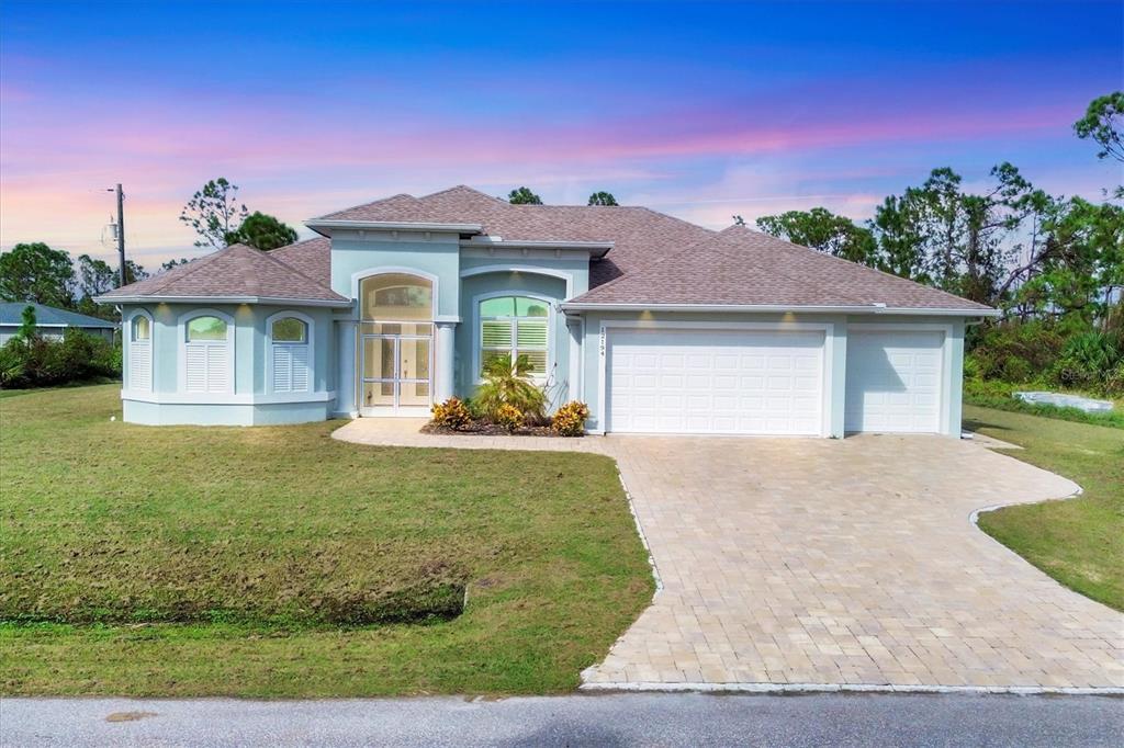 front view of a house with a yard