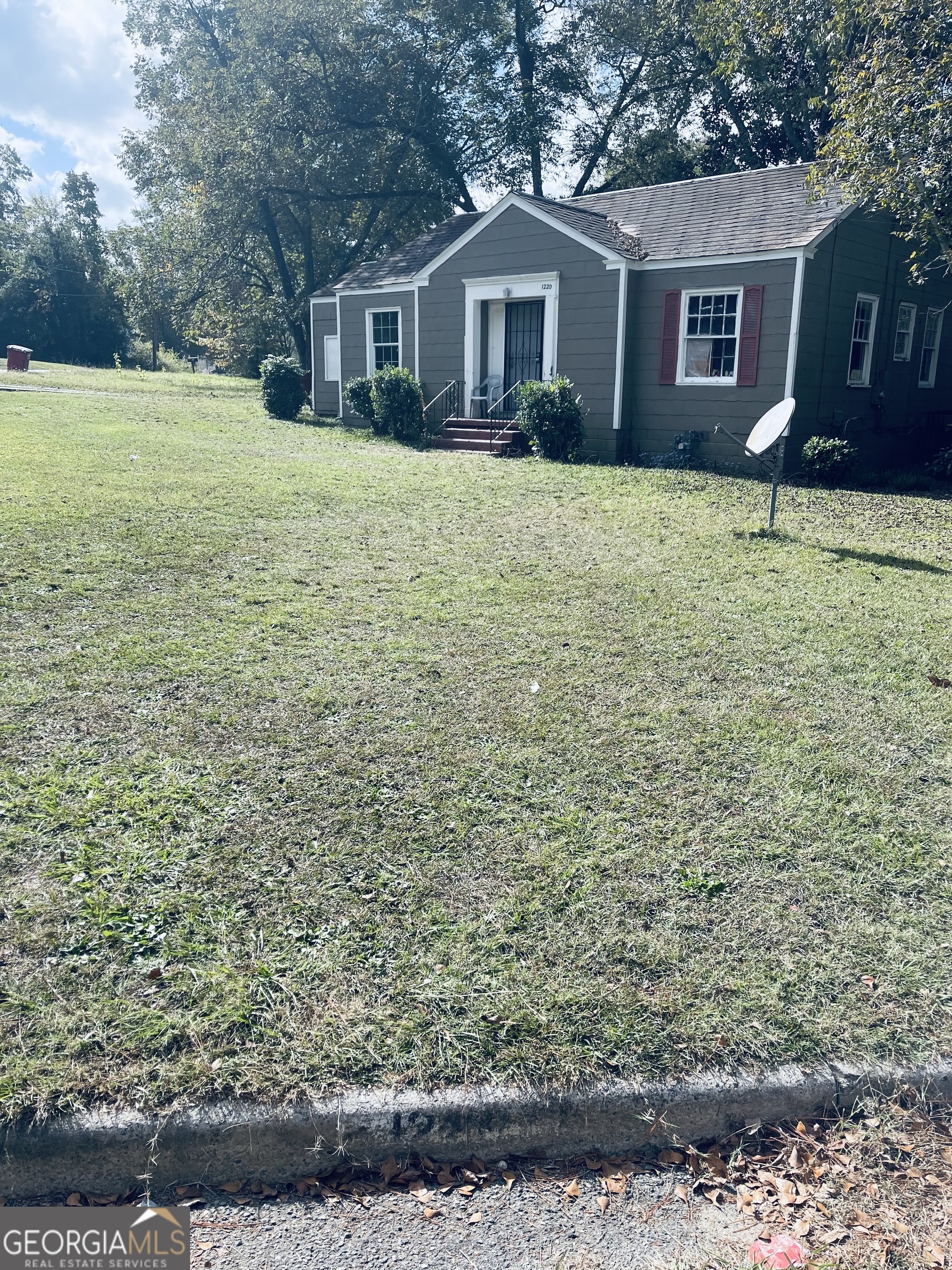 a front view of a house with yard