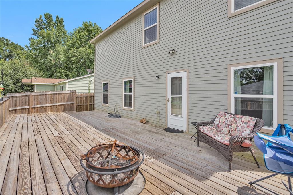 a view of a deck with table and chairs and wooden floor