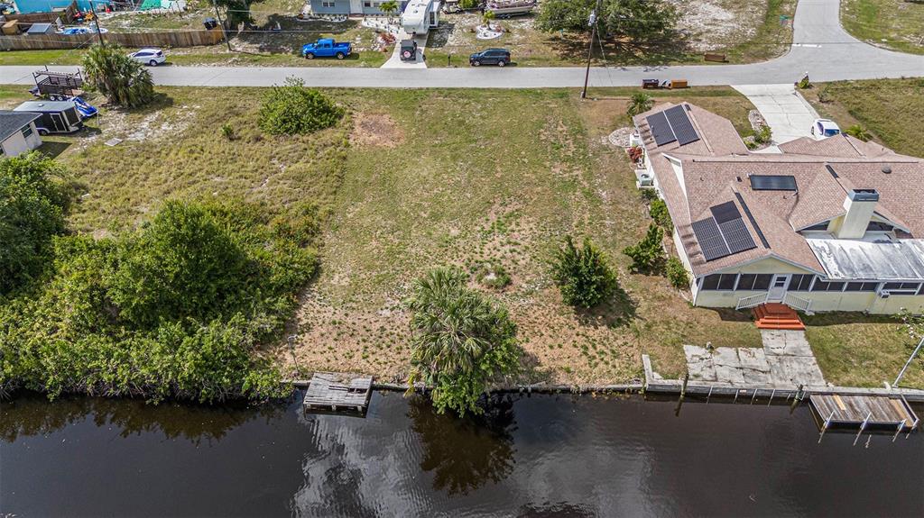 an aerial view of a house with lake view