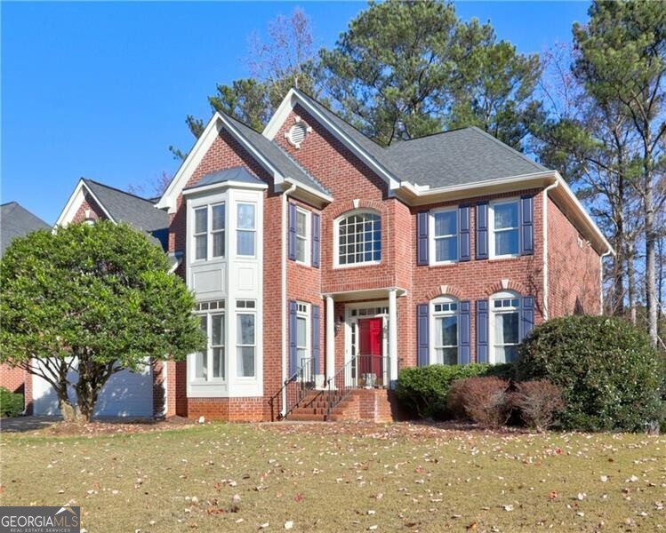 a front view of a house with a yard