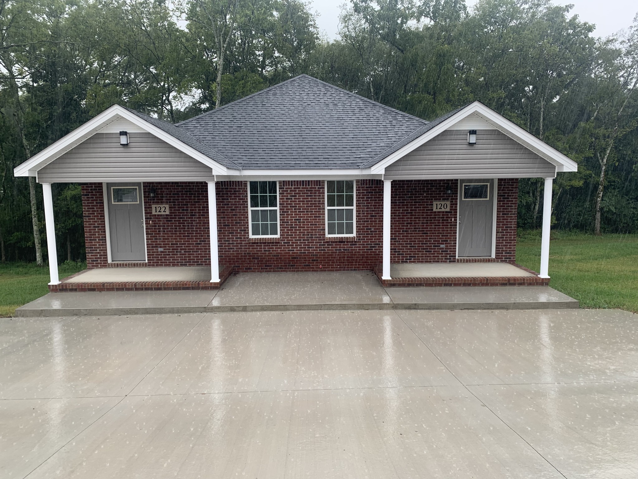 front view of a house with a yard