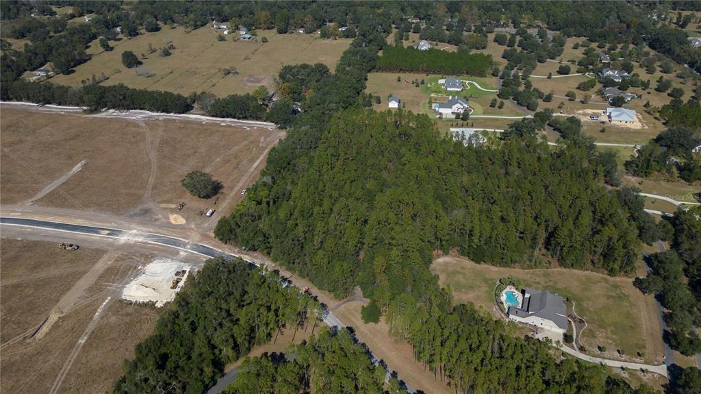 an aerial view of a residential houses with outdoor space