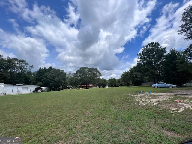 a view of a field with an trees