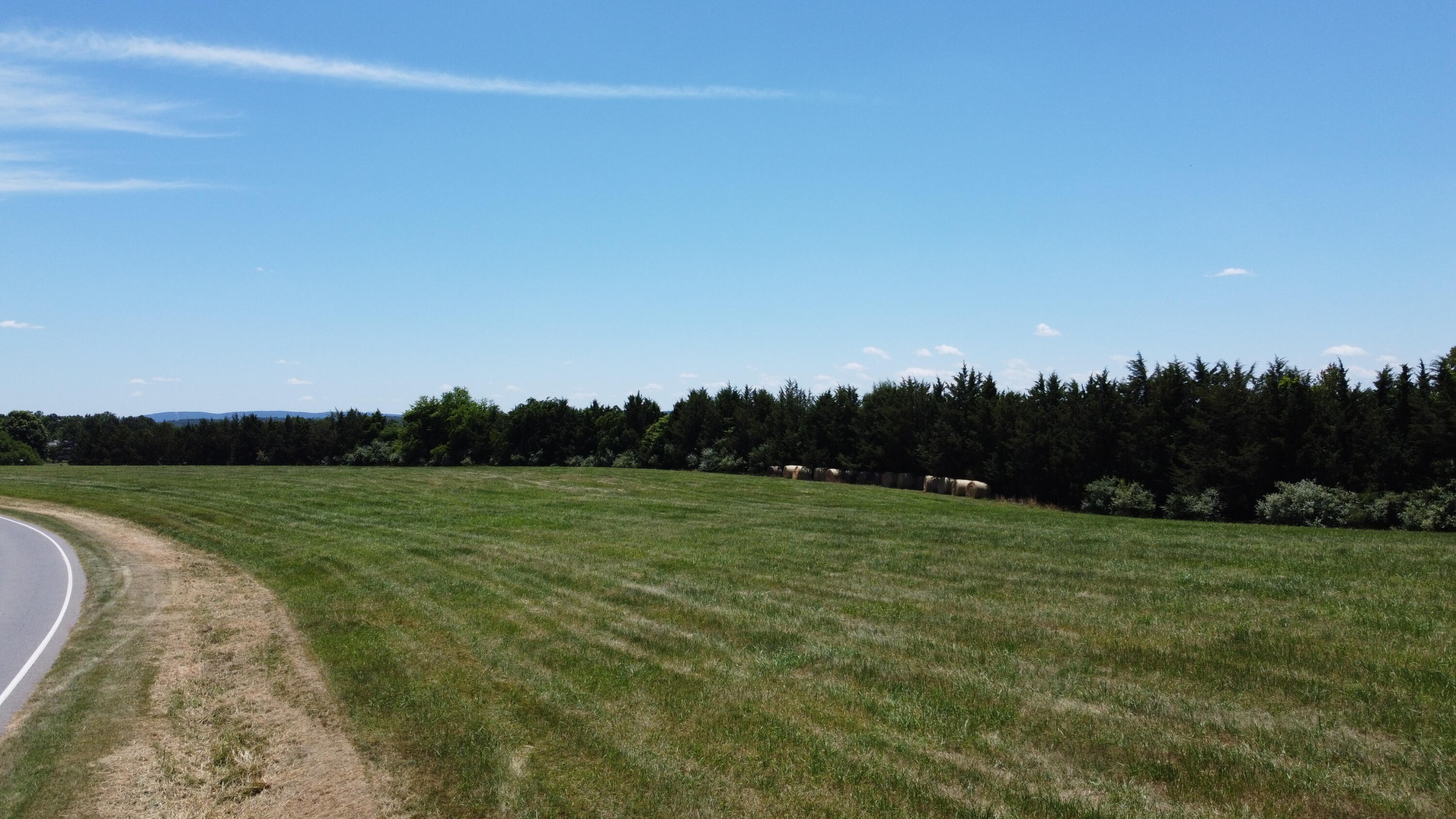 a view of grassy field with mountain