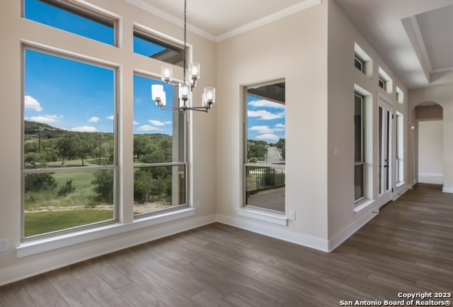 a view of a glass door with wooden floor