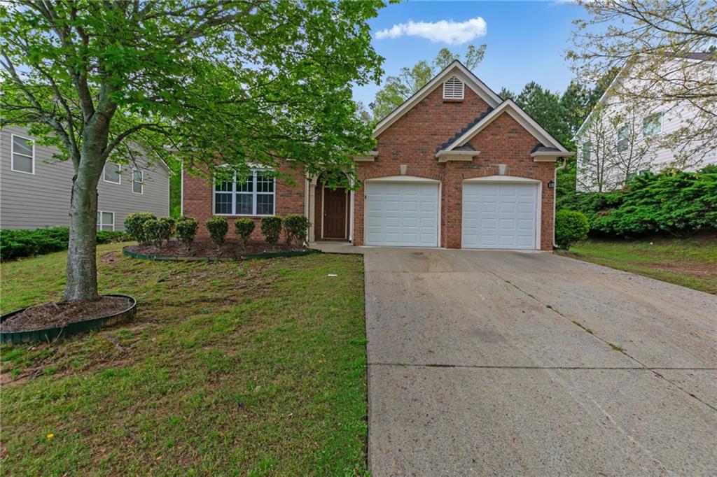 front view of a house with a yard