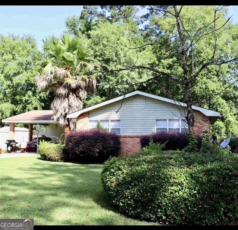 a view of a back yard with green space