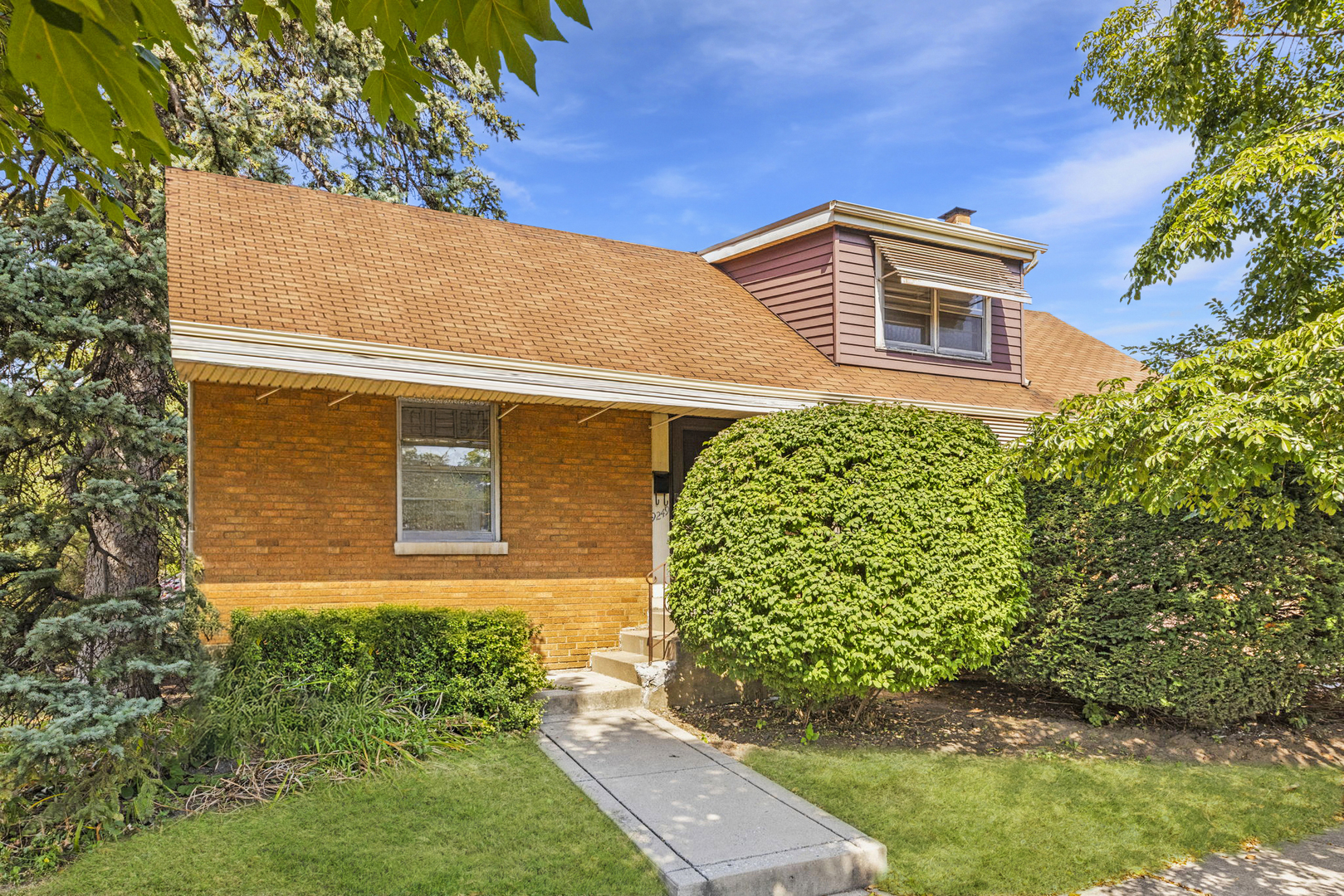 a view of a house with brick walls