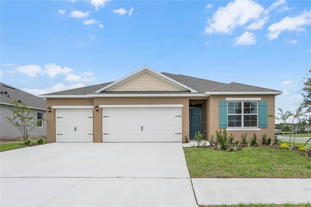 front view of a house with a yard