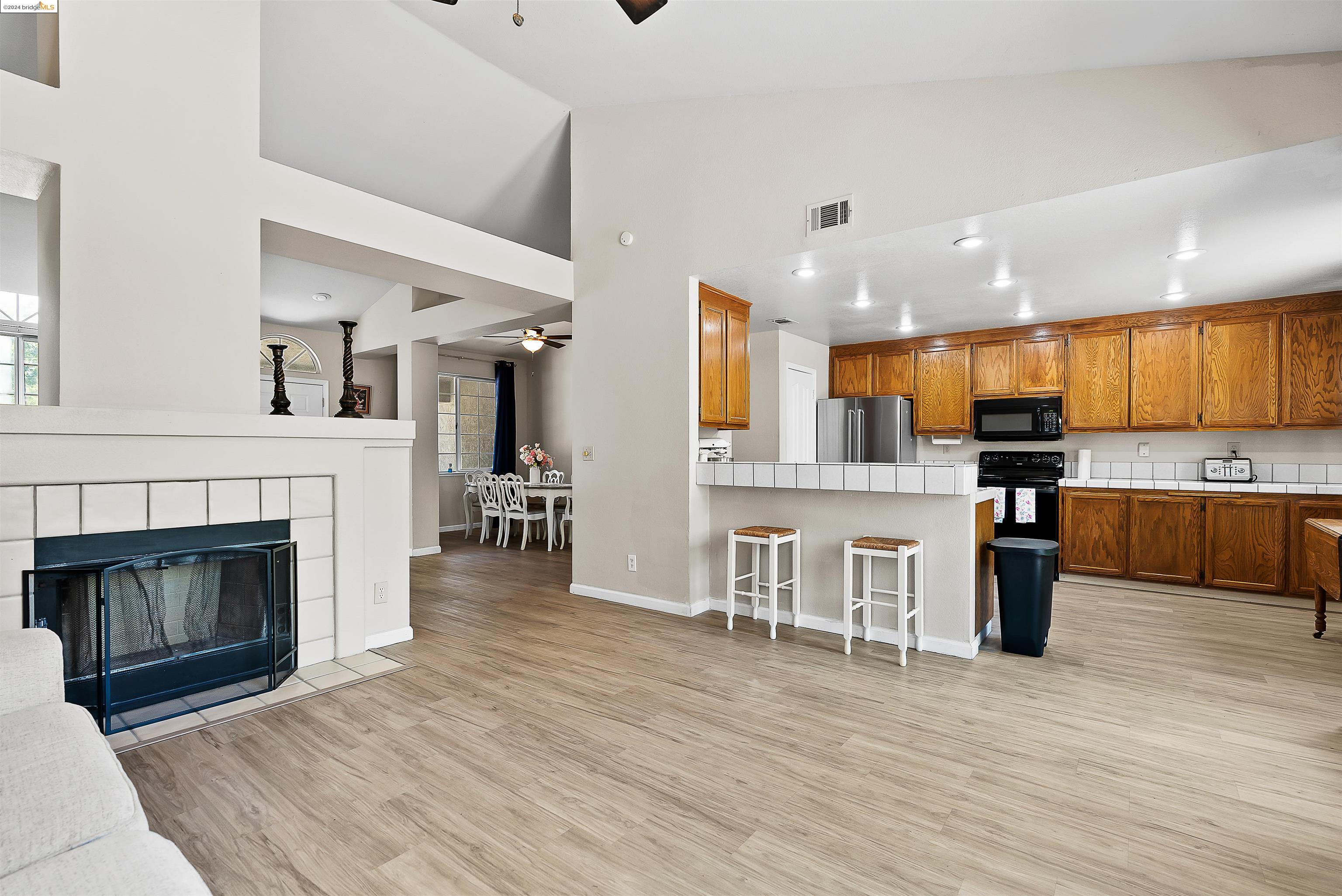 a view of kitchen with cabinets and wooden floor