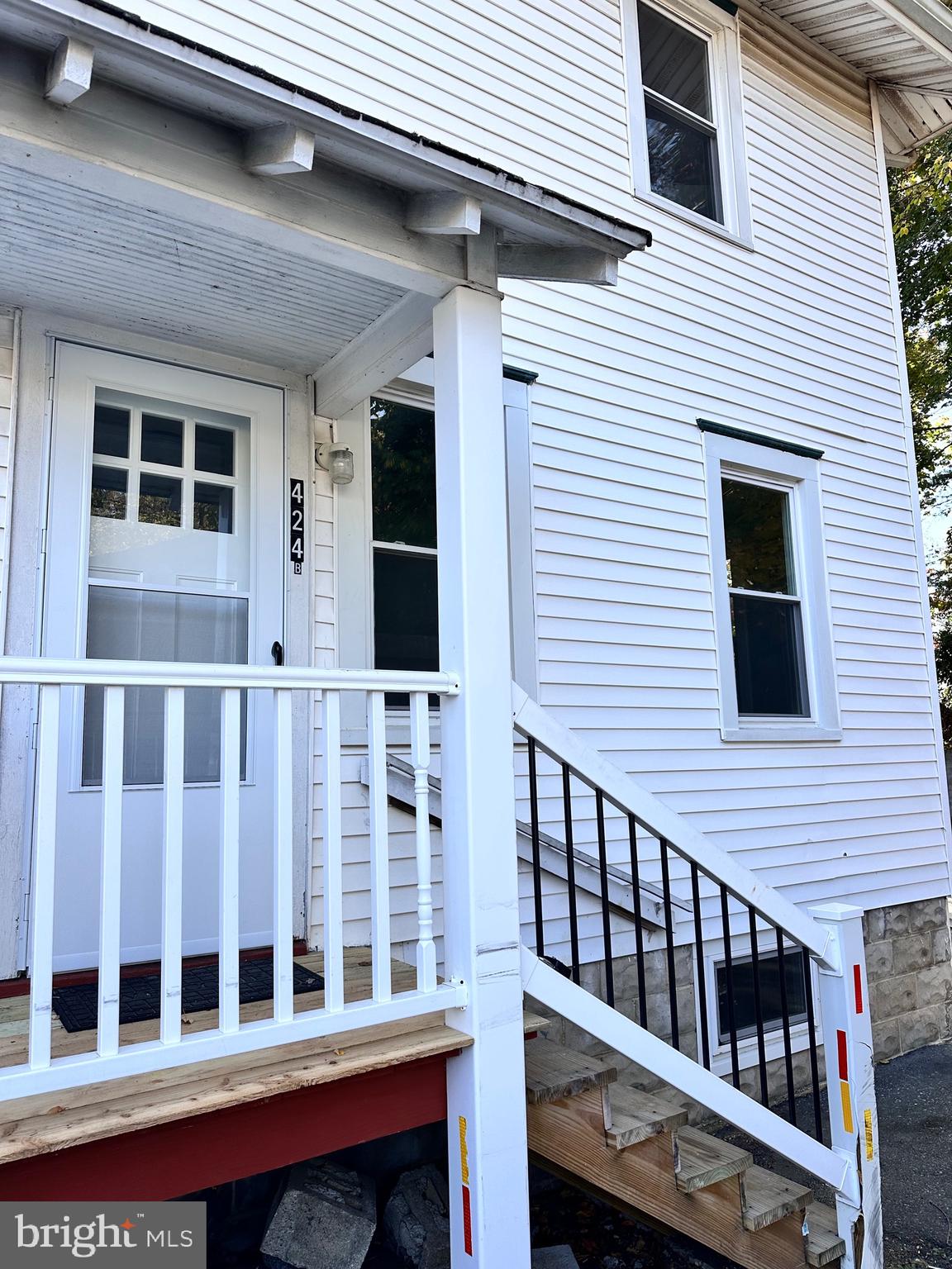 a view of a house with wooden deck